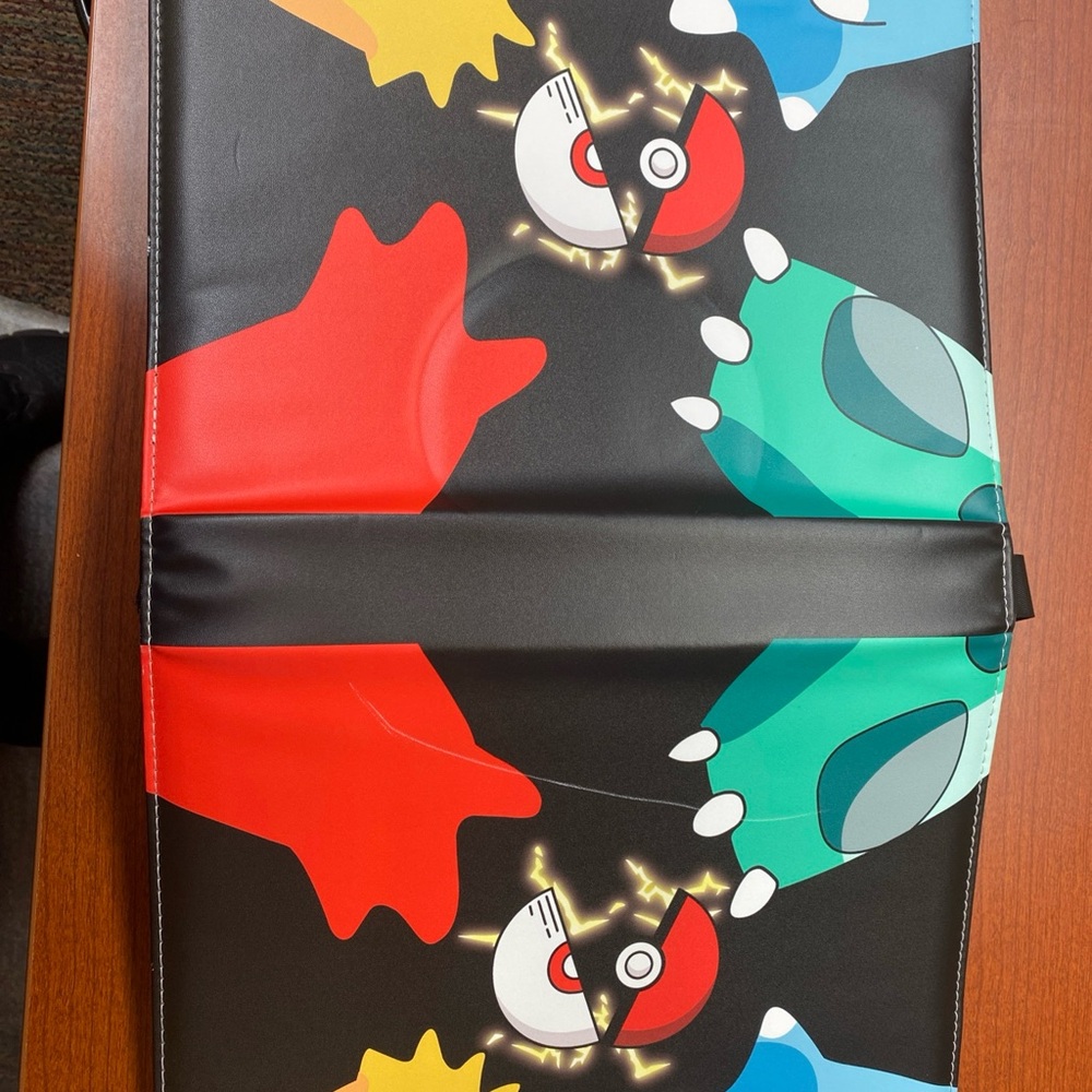 Colorful Pokémon trading card book
